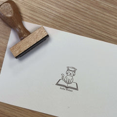 Timbro ex libris gatto sul libro